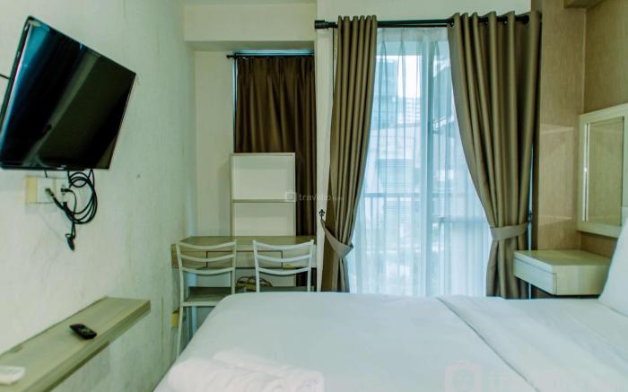 Homey and Warm Studio Room at Tifolia By Travelio