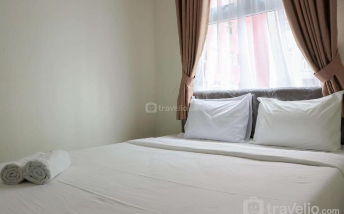 Well Design 2BR at Green Pramuka City By Travelio