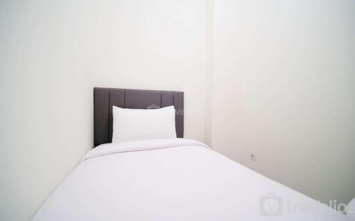CozyLiving 2BR at Puncak Dharmahusada By Travelio