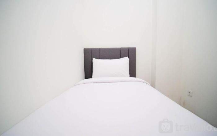 CozyLiving 2BR at Puncak Dharmahusada By Travelio