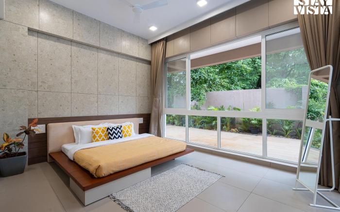 StayVista's Rosso with Outdoor Pool, Theatre-Disc Room & Games Room