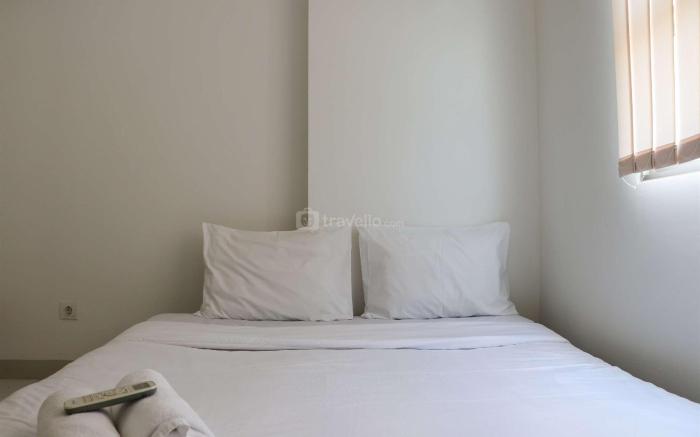 Cozy 2BR at Mekarwangi Square Apt By Travelio
