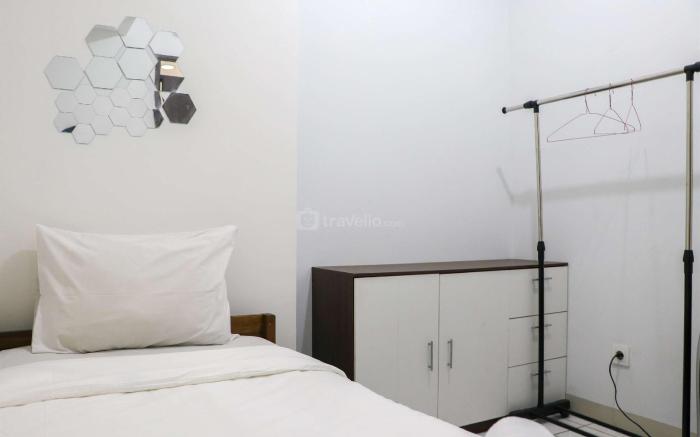 Cozy 2BR at Mekarwangi Square Apt By Travelio