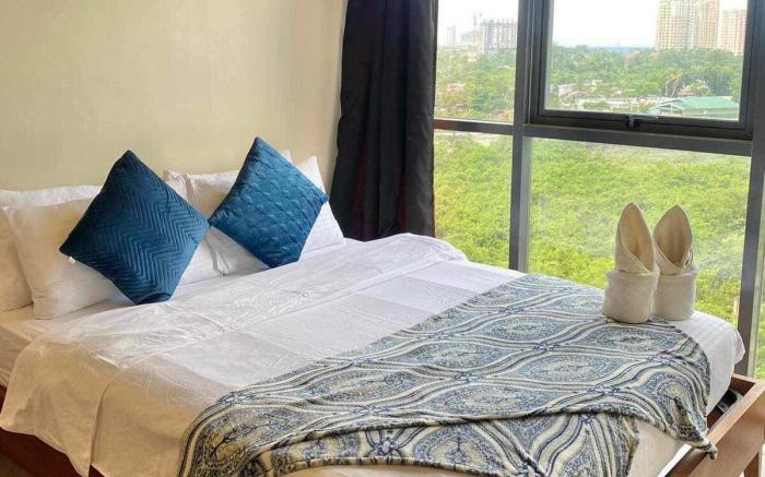 Mactan Newtown 2 BR w/ 4 beds +Pool access