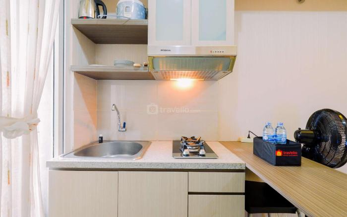 Homey 2BR at Green Pramuka City Apt By Travelio