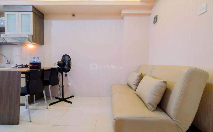 Homey 2BR at Green Pramuka City Apt By Travelio