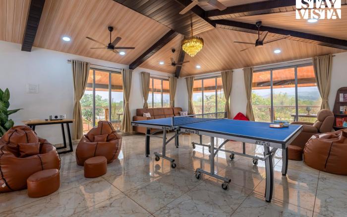 StayVista at Rio Vista with Pool, Lawn, Music Speaker & Game