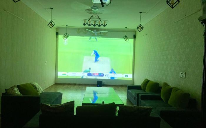 7. 3bhk theater big screen relax by instay