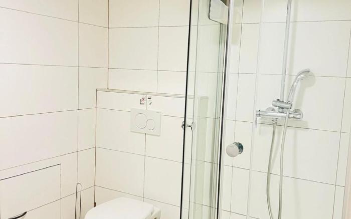 Cozy Basement Fashion District by OneLuxStay