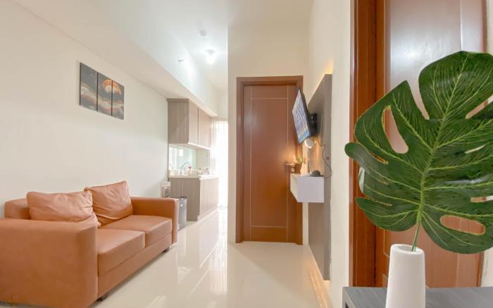 Minimalist 1BR Apt Vittoria Residence By Travelio