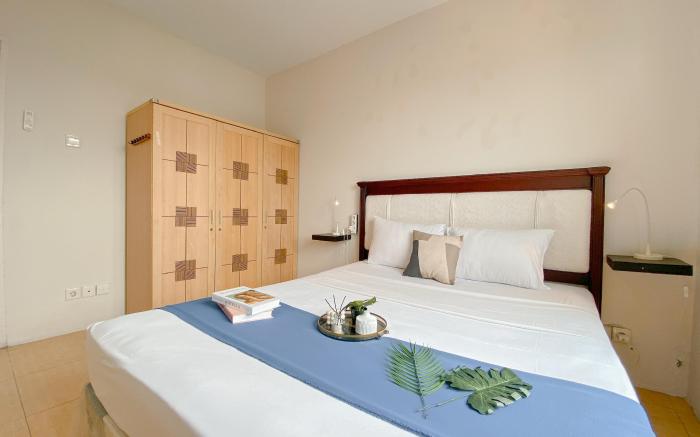 Minimalist Comfy 2BR Apt Puri Garden By Travelio