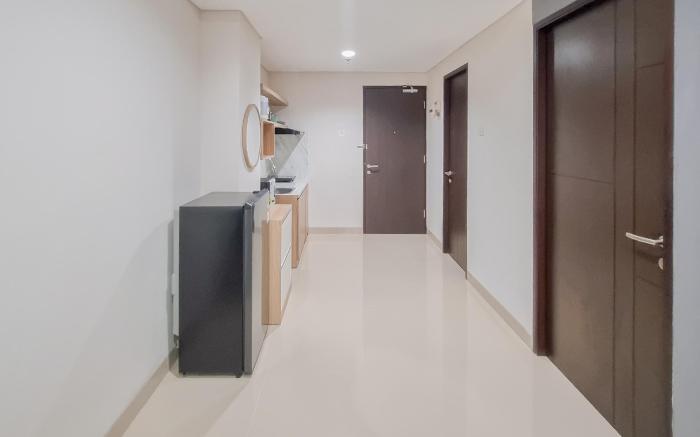Minimalist 1BR Patraland Amarta Apt By Travelio