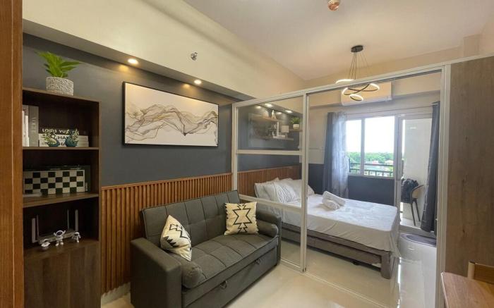 Bright & Stylish Condo w/ Pool View + Balcony