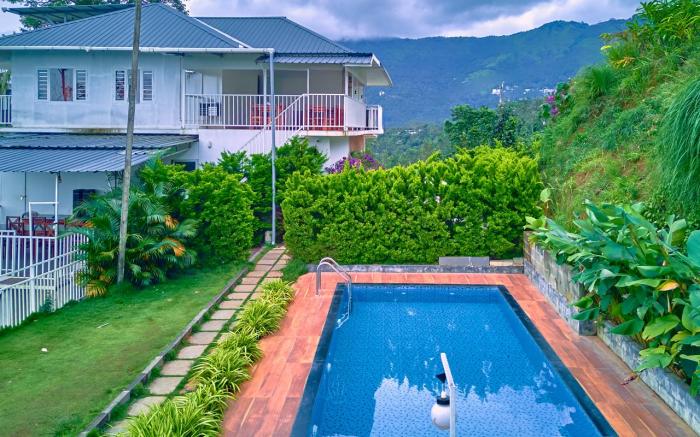 Ice Pellets Pool Resort Munnar by VOYE HOMES 