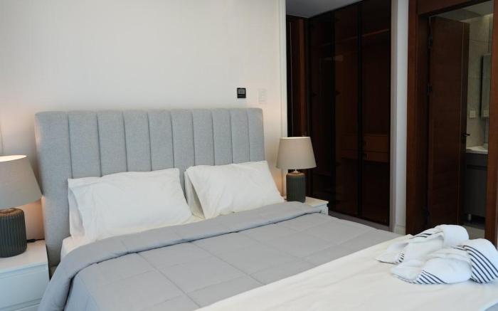 Modern 2BR Condo with Infinity Pool & Gym