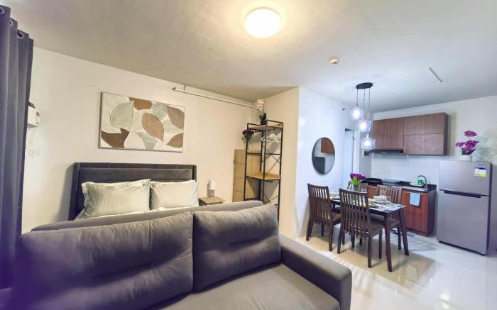 Stylish Condo Stay w/ Pool, Balcony & Near Airport