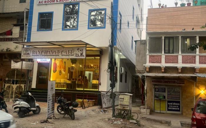 Hotel blue expire AC room $ roof top Restaurant