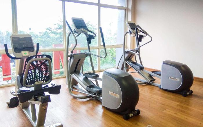 Studio near Mall at Tifolia Apartment By Travelio