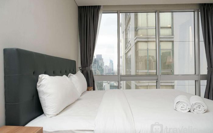 Cozy 2BR Empyreal Epicentrum Apartment By Travelio