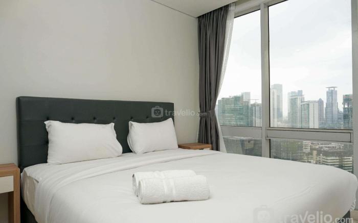 Cozy 2BR Empyreal Epicentrum Apartment By Travelio