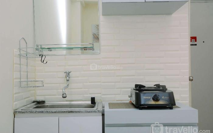 Comfort Studio at Green Pramuka Apartment near Shopping Center By Travelio