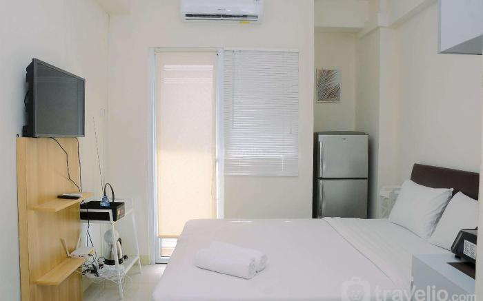 Comfort Studio at Green Pramuka Apartment near Shopping Center By Travelio