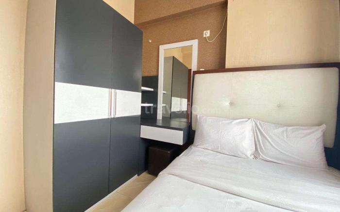 Comfy & Well Appointed 2BR at Tamansari Panoramic Apartment By Travelio