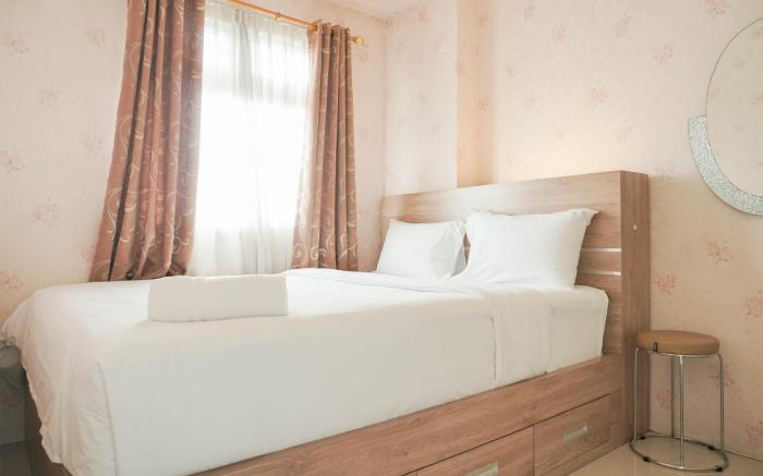 Comfort 2BR Green Pramuka City Apartment near Shopping Center By Travelio