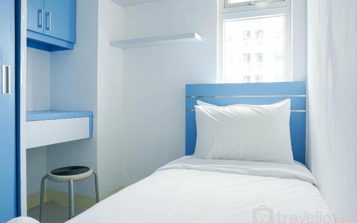 Homey and Fresh 2BR Green Pramuka Apt By Travelio