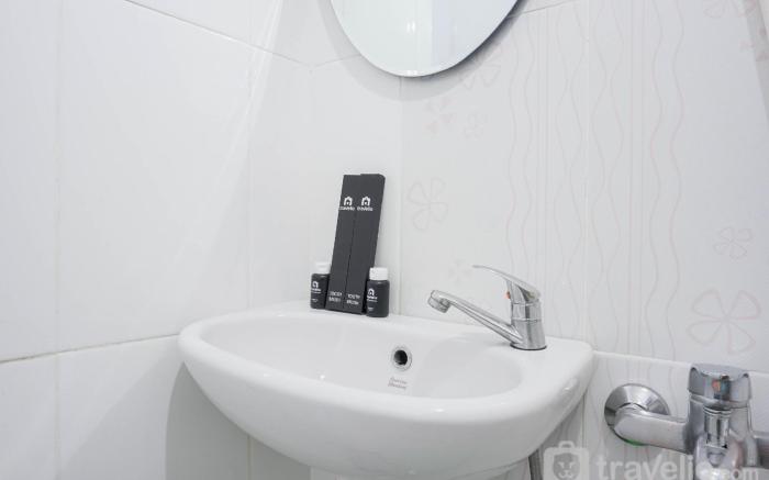 Homey and Fresh 2BR Green Pramuka Apt By Travelio
