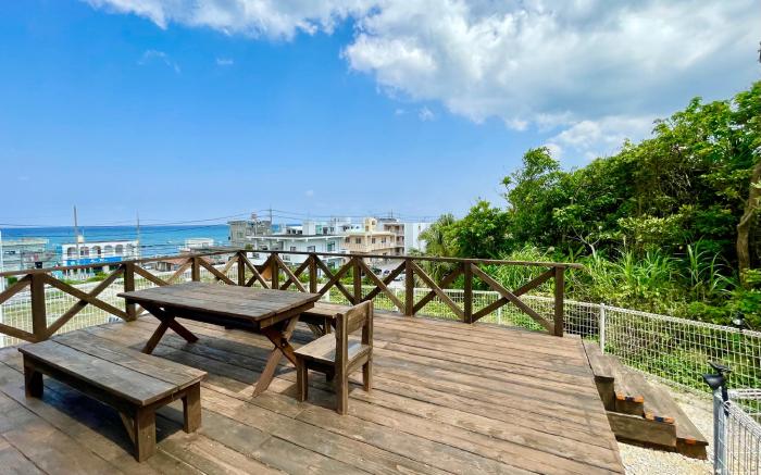 Coral Palace Onna by Sunset Avenue