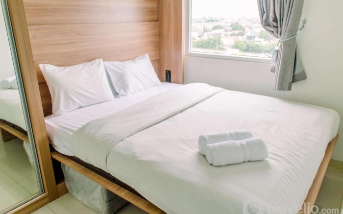 Warm & Cozy 2BR at Green Pramuka City By Travelio