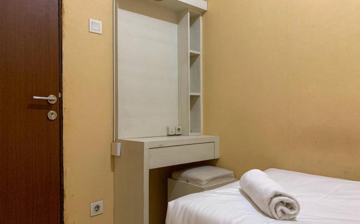 Warm and Cozy 2BR at Tifolia Apartment By Travelio