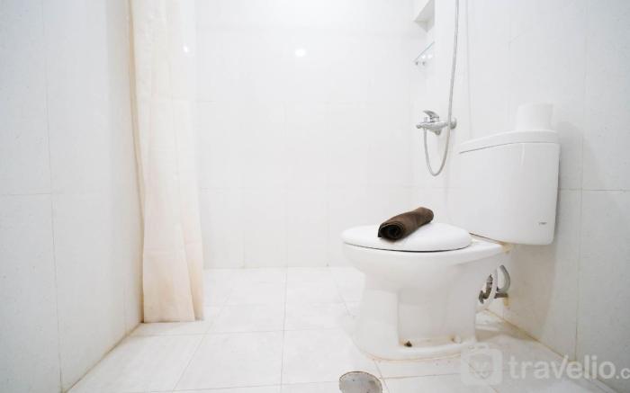 Homey 2BR Extra Room at Taman Beverly By Travelio