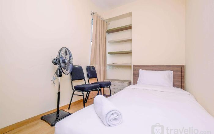 Comfortable and Warm 2BR at Tifolia By Travelio