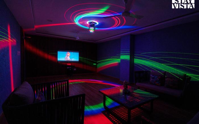 StayVista's Rosso with Outdoor Pool, Theatre-Disc Room & Games Room