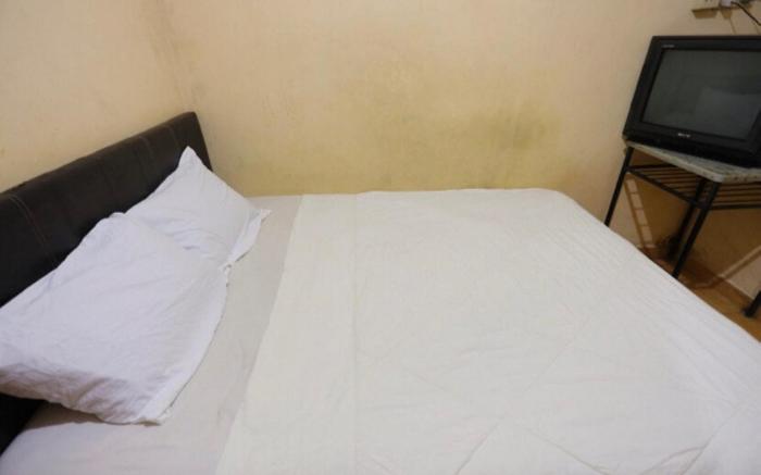 SPOT ON 93460 Lewi Family Guest House Near GBKP Bangun Mulia Km. 11