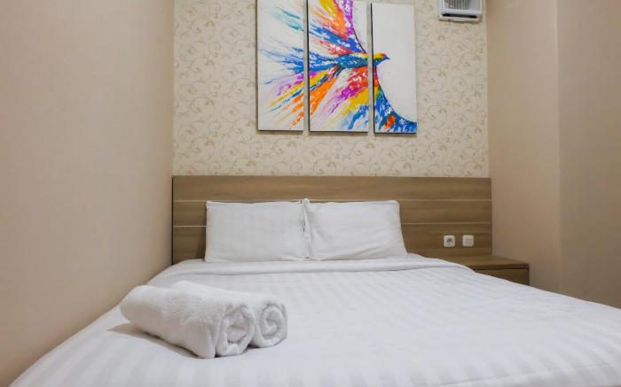 Cozy 2BR Green Pramuka Apartment By Travelio