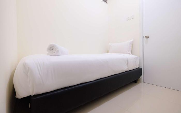 Cozy 2 BR Green Pramuka City Apartment By Travelio