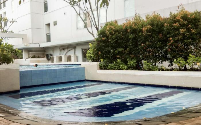 Homely 2 BR Bassura City Apartment By Travelio
