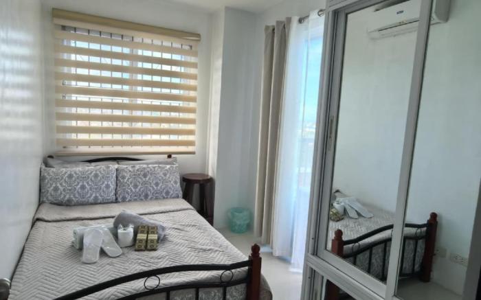 Two-bedroom Cityscape Bacolod 1001  w/ Pool Access