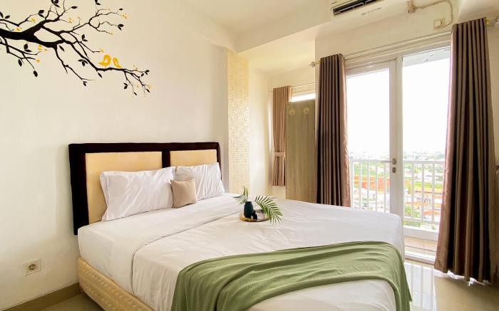 Homey & Cozy Living Studio at Poris 88 By Travelio