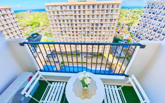 Cozy Condo near Airport, with Pool & Sea View