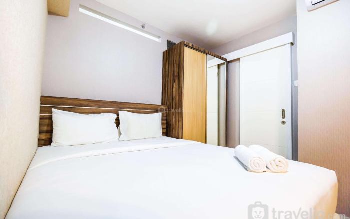 Classic 2BR Bassura City Apartment By Travelio