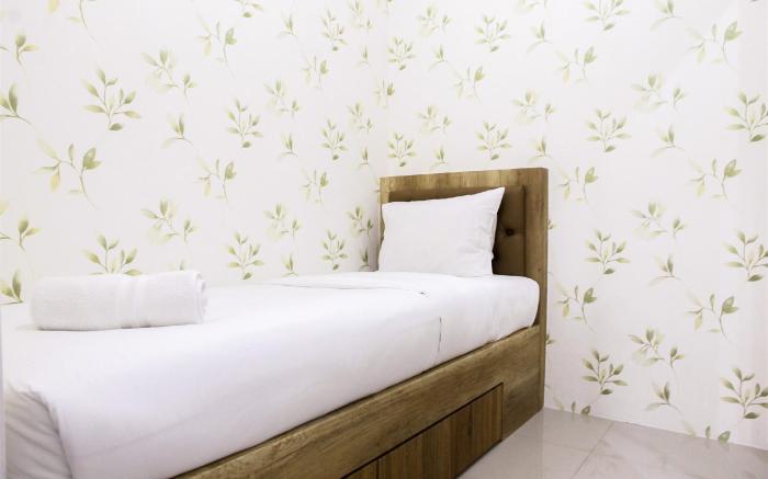 Well Designed 2BR Green Pramuka Apt By Travelio