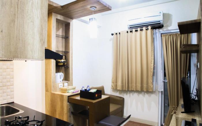 Well Designed 2BR Green Pramuka Apt By Travelio