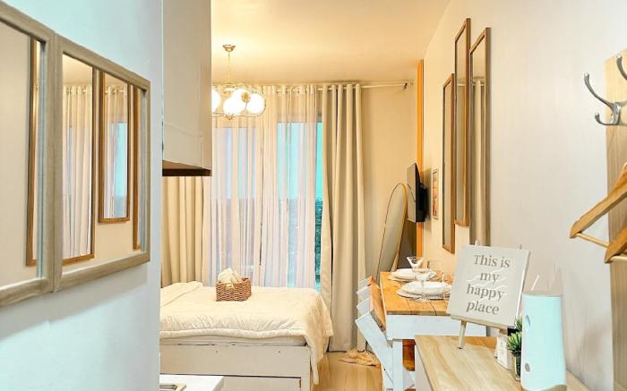 Corner Unit with Ocean View Near Airport and Beach