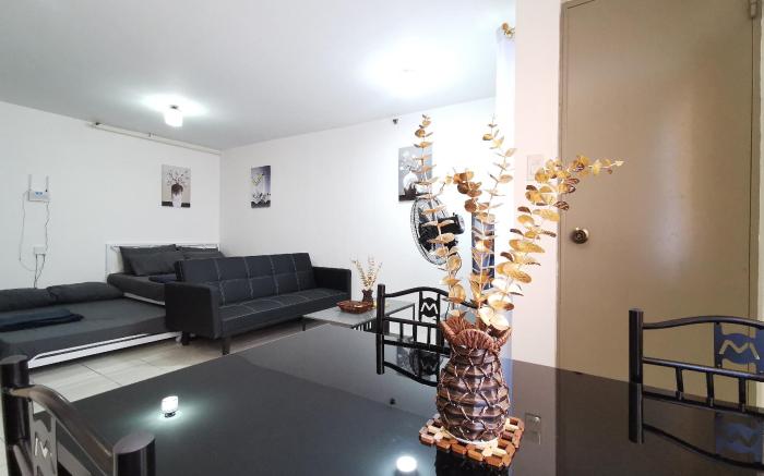 LUNA STAYCATION Cozy Condo near Enchanted Kingdom