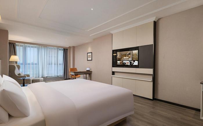 Vienna International Hotel Zhoukou Wanguo Car World Wenchang Wanda