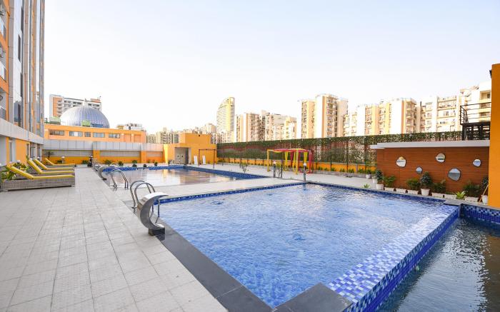 FabHotel Prime Spectrum Metro - With Pool |  5 mins Walk from Sector 75 Metro